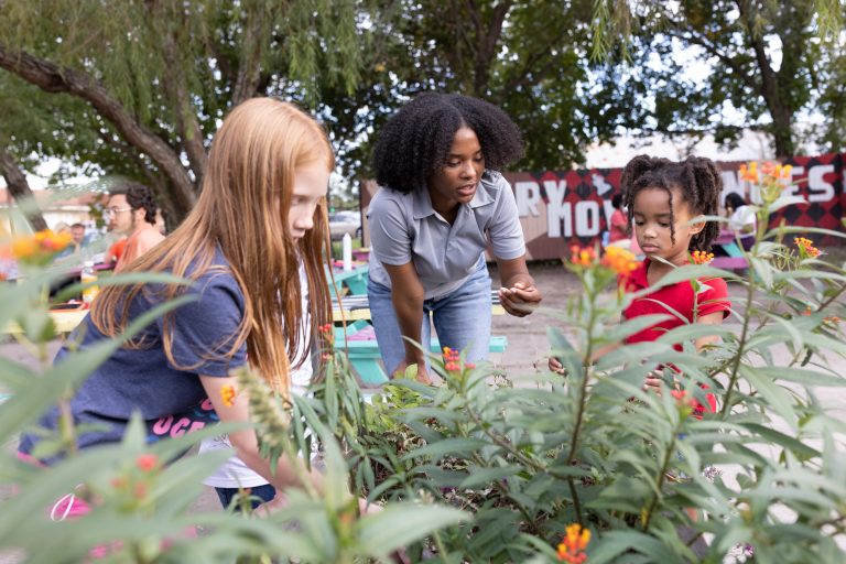 Members of the Rotary Club of Houston Skyline, Texas, USA, and other clubs in the area clean up litter at the Third Ward Chess Park in Houston. The clubs and their community partners turned a vacant lot into a park with picnic and chess tables, garden beds, and public art. 14 November 2021.